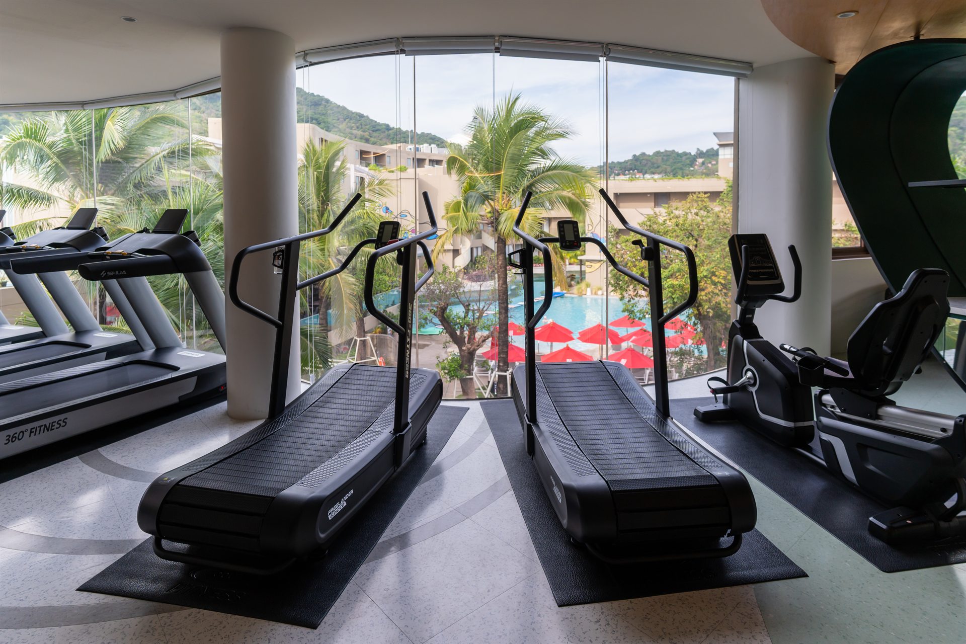 Fitness centre overlooking tropical greenery at Metadee Concept Hotel in Phuket