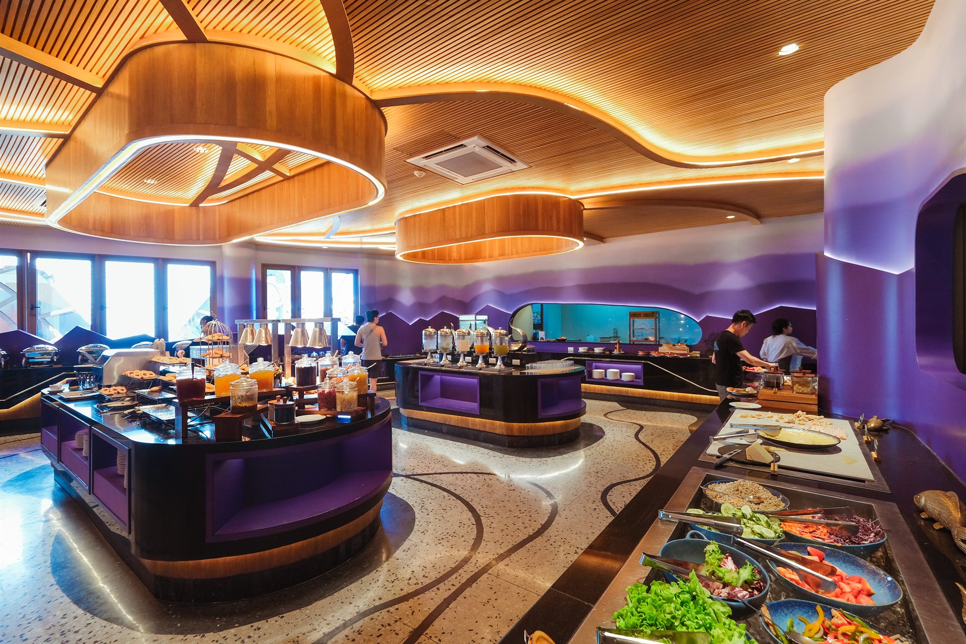 Breakfast Together at Metadee Concept Hotel Phuket Breakfast buffet with food stations beneath a curved wooden ceiling at Metadee Phuket