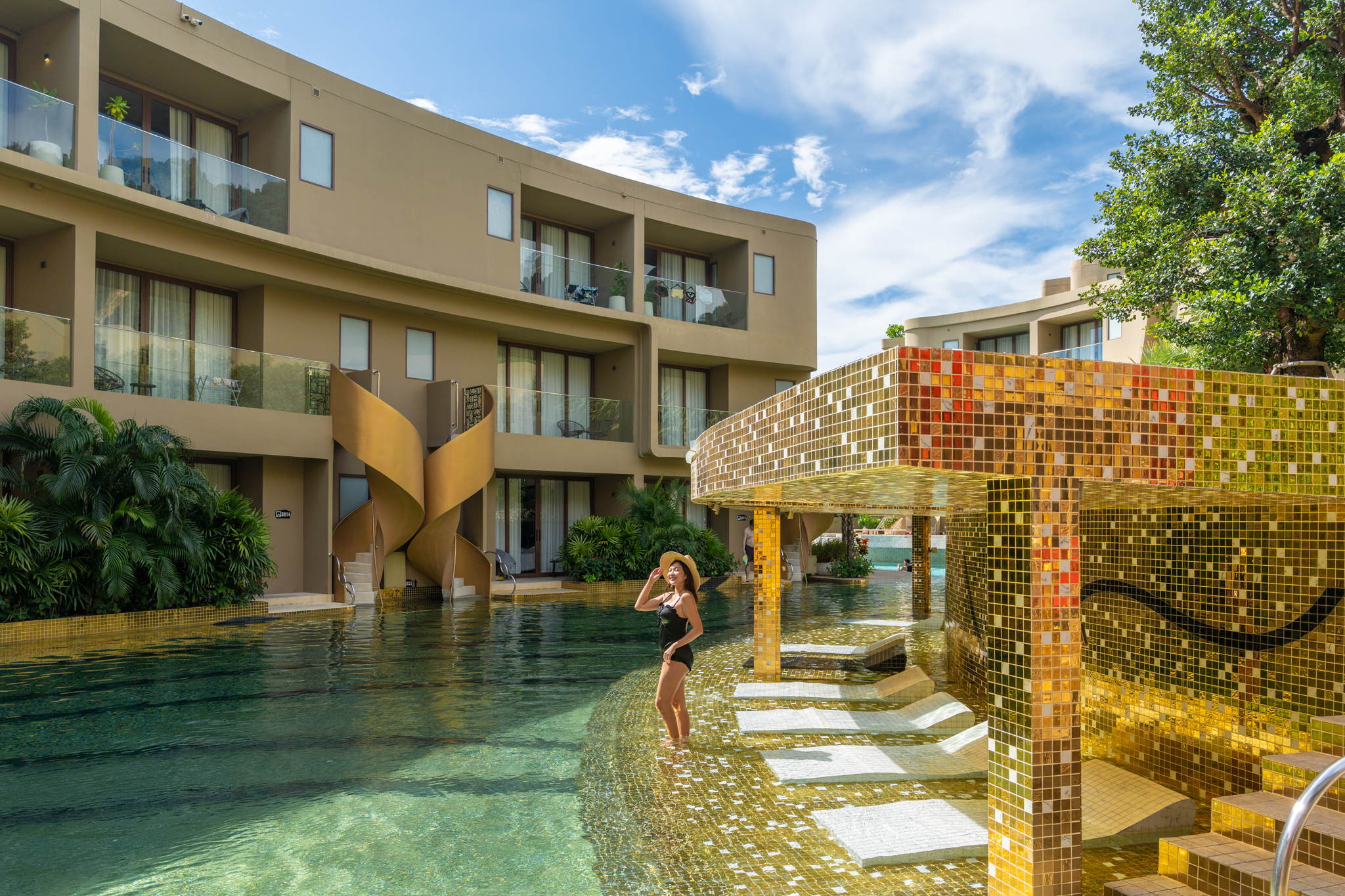 Guest enjoying the lagoon-style swimming pool at Metadee Concept Hotel in Phuket